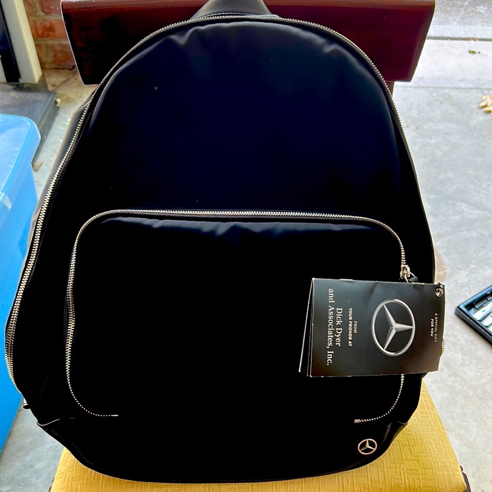 Mercedes Haerfest Black Bookbag With Gift Tag.